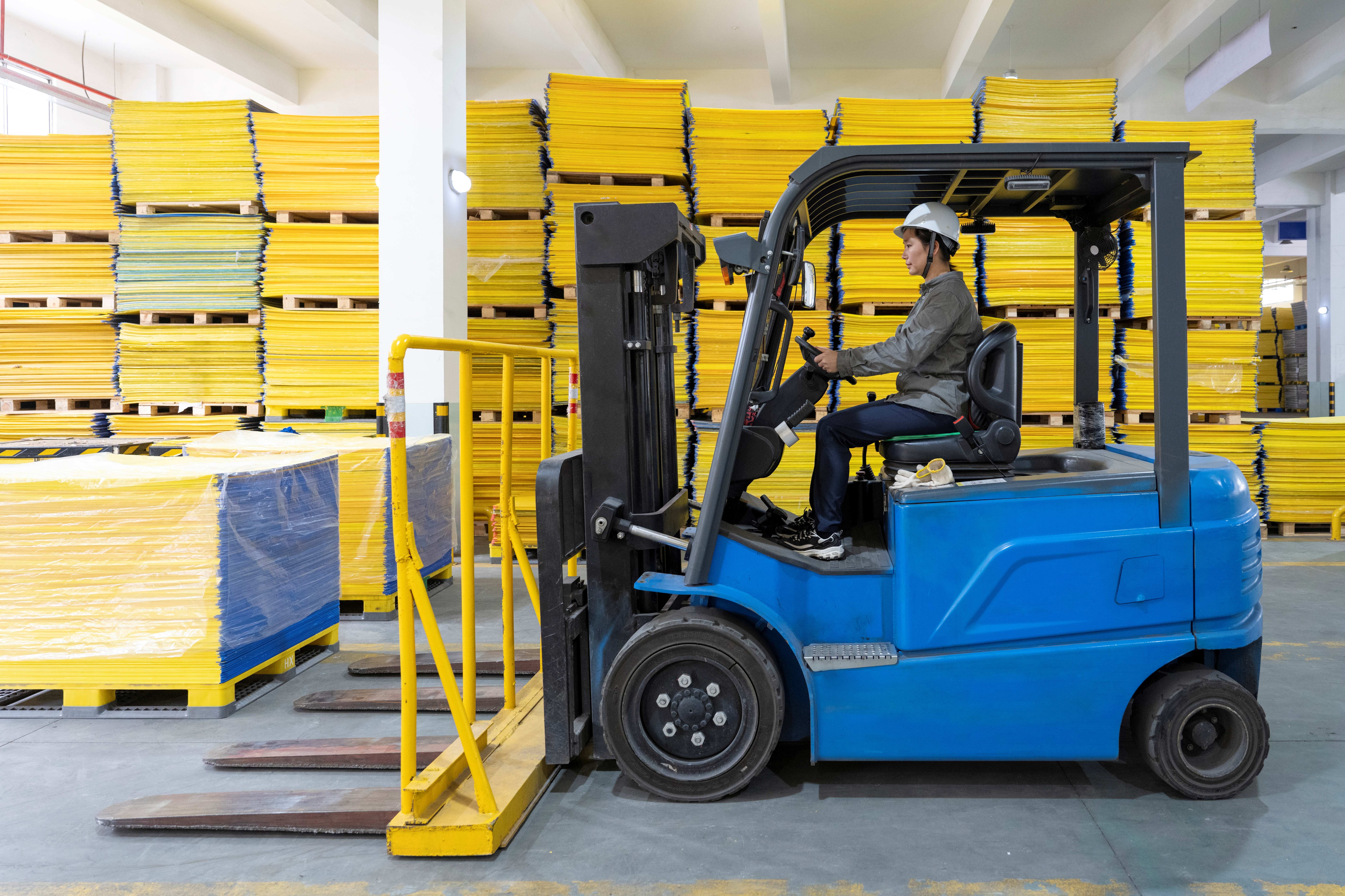 Woman operating a forklift